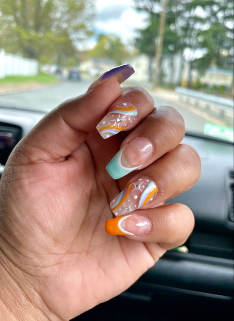 Swirl rainbow design on medium length squared acrylic nails. Pastel colors-light blue, orange, purple. White stars with Diamond gems. Star Acrylic Nails, Acrylic Nails Pastel, Star Acrylic, Nails Pastel, White Stars, Square Acrylic Nails, Rainbow Design, Pastel Colors, Nail Ideas