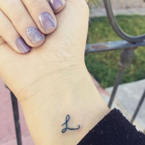 65 Amazing L Letter Tattoo Designs and Ideas 43 L Initial Tattoo, Letter L Tattoo, Small Letter Tattoo, Family First Tattoo, Lucky Tattoo, Easy Tattoo, L Initial, Anchor Tattoo Design, Tatoo Inspiration