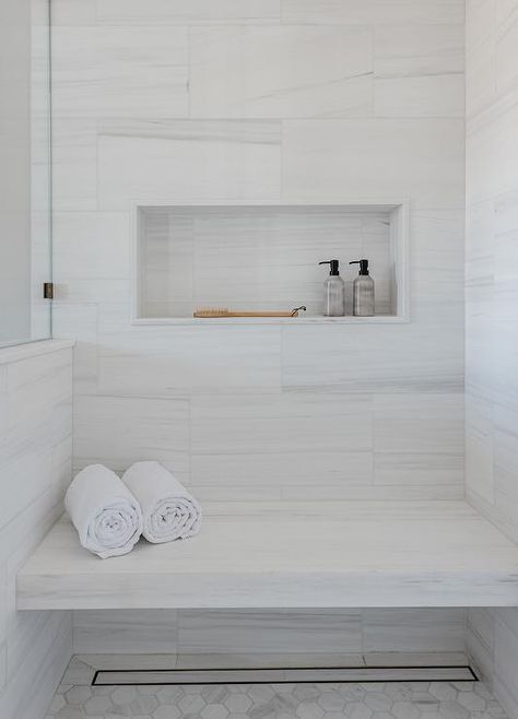 White Hexagon Shower Floor, Floating Shower Bench, Hexagon Shower Floor, Hexagon Floor Tiles, Marble Shower Walls, Tile Shower Niche, Blue Laundry Rooms, Herringbone Wall, Off White Kitchens