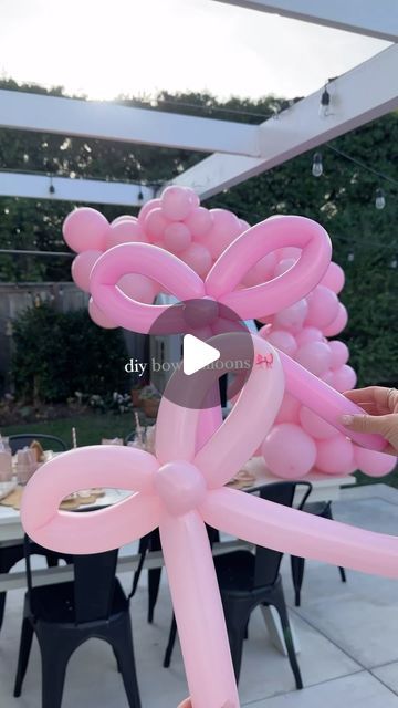 Deborah Trette on Instagram: "how to make bow balloons! 🎀 they came out so beautiful and took the party set-up to a whole other level! obsessed! if you saw my stories, it took me a minute to figure out but then💡when off! i followed the tutorial by @megluxe! gingerbread partyware @mymindseyeinc stretch a 260 balloon inflate with hand pump twist and make a bunny ear x2 twist going the opposite way 🎀 for the last tricky part, twist a small section from under the bow and pinch into the middle of bow. save and share for christmas party inspo! #bow #bowtrend #bowballooon #diy #diypartydecor #diypartyideas #kidsbirthdayparty #christmasparty #christmasinspiration #partysetup #diy #amazonhome" How To Make Bow Balloons, Bow Party Centerpieces, Balloon Bows Diy, Bow Centerpiece Party Ideas, Balloon Bow Garland, Bow Party Ideas, Bow Balloon Garland, Bow Decorations Party, Bow Balloon Arch