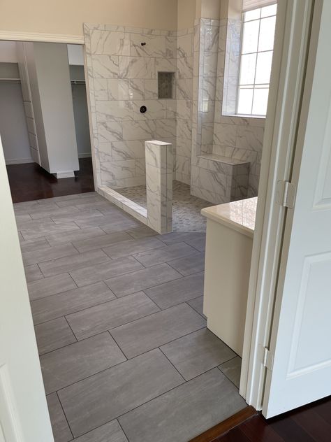 Finishes 12x24 tile style Neopolis laid on 1/3 offset brick pattern color Grey Bathroom Tile 12x24, 24x12 Tile Pattern, 12x24 Bathroom Tile, Large Bathroom Floor Tile Ideas, 12x24 Tile Patterns, Dark Floor Bathroom, Mound House, Brick Pattern Tile, Shower Tile Patterns