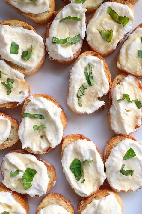 Ricotta with Lemon, Basil, and Honey Bruschetta | reluctantentertainer.com Ricotta Bruschetta, Honey Ricotta, Toasted Baguette, Fresh Ricotta, Easter Appetizers, Fingerfood Party, Bruschetta Recipe, Lemon Basil, Buffalo Chicken Dip