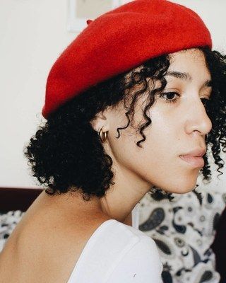 How to Wear a Beret with Curls, According to This Chic Parisian Jewelry Designer - Vogue Curly Hairstyles With Hats, Beret With Curly Hair, Beret Hairstyles, Curly Hair With Hat, Hairstyles With A Hat, Hairstyles With Hats, Hair Beret, Hair With Hat, Textured Curly Hair