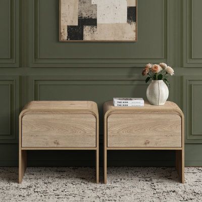 Arriving as a 2-piece set, this minimalist end table is a helpful storage solution for your living room or a handy nightstand in your bedroom. Crafted from engineered wood, it comes in an inviting finish that works with a variety of design aesthetics and color palettes. We love its curved drawer front and waterfall-style top for a hint of modern style. And there's just the right amount of interior space in the drawer for everything from books and lip gloss to daily or nightly essentials. Millwoo Low Profile Nightstand, Wabi Sabi Nightstand, Bed Side Tables Ideas, Wayfair Nightstand, Neutral Earthy Bedroom, Small Nightstand Ideas, Neutral Nightstand, Cool Nightstand, Japandi Nightstand