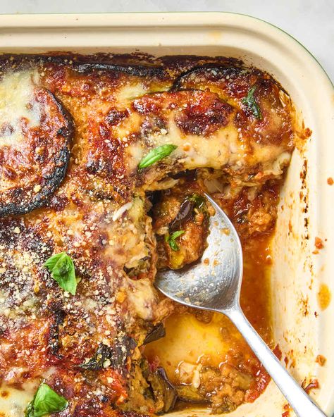 overhead shot of eggplant parmesan topped with basil, with a piece taken out of it Smitten Kitchen Eggplant Parmesan, Eggplant Spinach Bake, Deconstructed Eggplant Parmesan, Japanese Eggplant Parmesan, Make Ahead Eggplant Parmesan, Eggplant Dinners, Eggplant Parmesan Vegan, Eggplant Ideas, Eggplant Parmesan Casserole