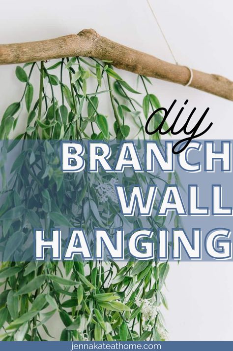 This simple wall hanging idea with a branch and greenery is the perfect way to add a touch of color to any room in your home. Plus, it's incredibly easy to make! How To Hang A Branch On The Wall, Eucalyptus Wall Hanging Diy, Tree Branch Diy Projects, Greenery Around Mirror, Greenery Above Bed, Greenery On Wall, Hanging Tree Branch Decor, Hanging Branch Decor, Grad Banquet