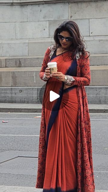 Vinothini Pandian on Instagram: "Saree Tales...

Strolling through Dublin streets in style: 
Embracing comfort and culture in this stunning rust and navy saree borrowed from @rekha.hariharan wardrobe. The crushed cotton saree features a mesmerizing Ajrakh full sleeve jacket, adorned with intricate embroidery on the shoulders and sleeve edges. 
Paired with boots, beret, and rustic accessories, every step tells a story. ☕🍂

Saree & Jacket:- @pranaahbypoornimaindrajith
Shades: #francessca
Boots : @zara
Beret:- #potatocakecompany

#SareeStyle
#CulturalChic 
#DublinDiaries
#SareeTales 
#crushedcotton
#ajrakhjacket
#southindianstylist" Saree With Boots, Navy Saree, Ajrakh Sarees, Saree Jacket, Dublin Street, Saree Jackets, Rustic Accessories, Intricate Embroidery, Sleeve Jacket