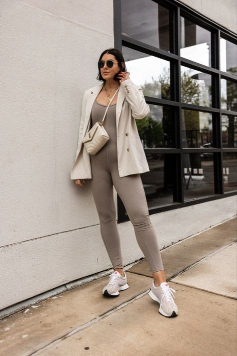 Wearing an active jumpsuit from Dynamite for an easy pulled together spring outfit. worn with an oversized blazer and new balance sneakers Romper With Blazer Outfits, Active Jumpsuit Outfit, Romper With Blazer, Blazer And Sneakers Outfit, Amazon Wardrobe, Blazer Jumpsuit, Athleisure Jumpsuit, Athleisure Outfits Spring, Beige Jumpsuit