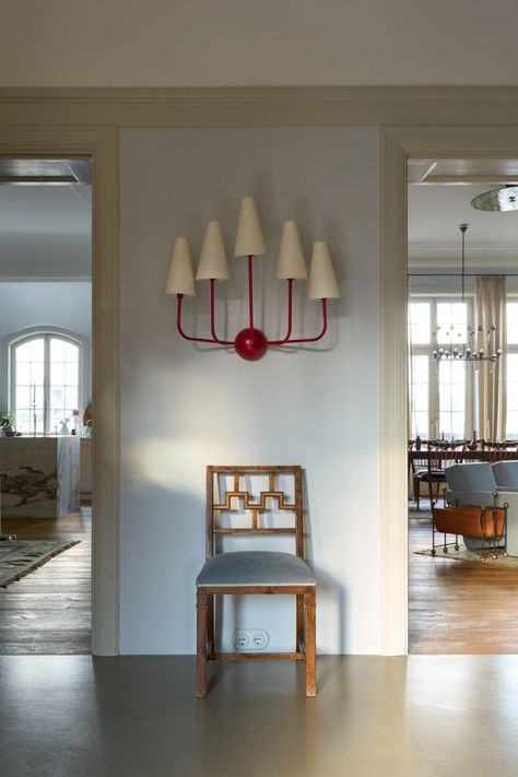 An interior designer's graceful Art Nouveau apartment in Stockholm | House & Garden Swedish Rug, Red Armchair, Built In Cabinet, Vintage Stool, Round Stool, Red Walls, Pierre Frey, Swedish Design, Scandinavian Design