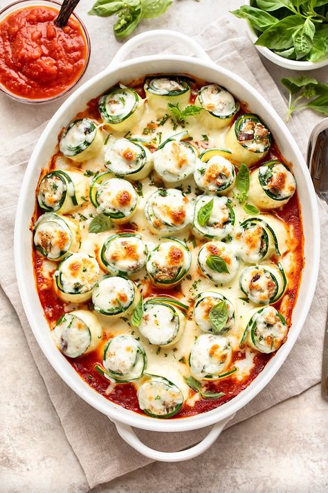 These zucchini roll ups are filled with a savory combination of Italian sausage, ricotta, spinach and mushrooms, then topped with mozzarella! | thecozyapron.com #zucchinirollups #zuc #zucchinirollupslasagna #zucchinirollupsricotta #zucchinirollupshealthy #zucchinirollupsrecipes Zucchini Roll Ups, Sausage Ricotta, Zucchini Roll, Ricotta Spinach, Hand Pies Savory, Spinach And Mushrooms, Zucchini Rolls, Stuffed Baked Potatoes, Roll Ups Recipes