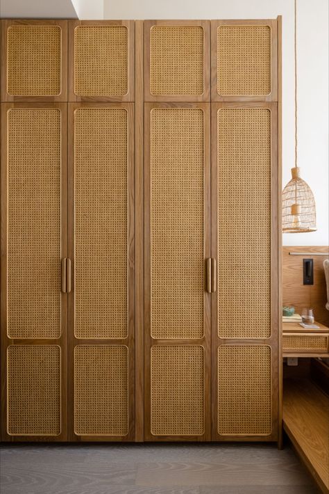 Our storage cabinet keeps things neatly organized with its adjustable shelves in the interior, and drawers and open shelves with adjustable heights. This cabinet is designed to be a sustainable piece of furniture with its solid wood handles, FSC certified solid wood trims, and bamboo and rattan finish. Boho Wardrobe Closet, Wardrobe Design Bedroom Boho, Bamboo Wardrobe Doors, Rattan Finish Wardrobe, Rattan Door Cabinets, Rattan Bedroom Design, Wooden Finish Wardrobe, Modern Wardrobe Design Ideas, Rattan Wardrobe Design