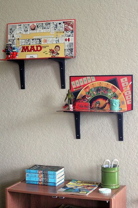 Dvd Stand Ideas, Board Game Wall Shelf, Funky Display Ideas, Diy Decor For Men, Home Decor Upcycle, Eclectic Diy Decor Ideas, Board Game Wall Decor, Thrifted Diy Decor, Boardgame Shelf Ideas