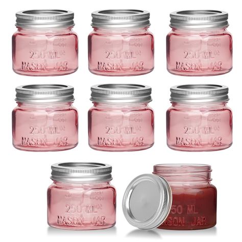 PRICES MAY VARY. SET OF 8 CUTE PINK CANNING JARS: The colors are cute, just putting them in the kitchen will make the mood even happier! HIGH QUALITY MINI MASON JARS: Made of food grade glass, thick and durable. Reusable throughout the year. Compact and portable, with a leak proof lid. VERSATILE USES: You can use it as spice jars, candle jars, honey jar, small glass containers, baby food jars, honey jars, overnight oats jars, candy jars, jelly jars, jam jars, or decorative jar for small parts. I Repurposed Candle Jars, Pink Jars, Small Mason Jar Candles, Mason Jars Pink Flowers, Repurpose Candle Jars, Small Glass Containers, Purple Mason Jars, Gold Mason Jars, Pink Mason Jars