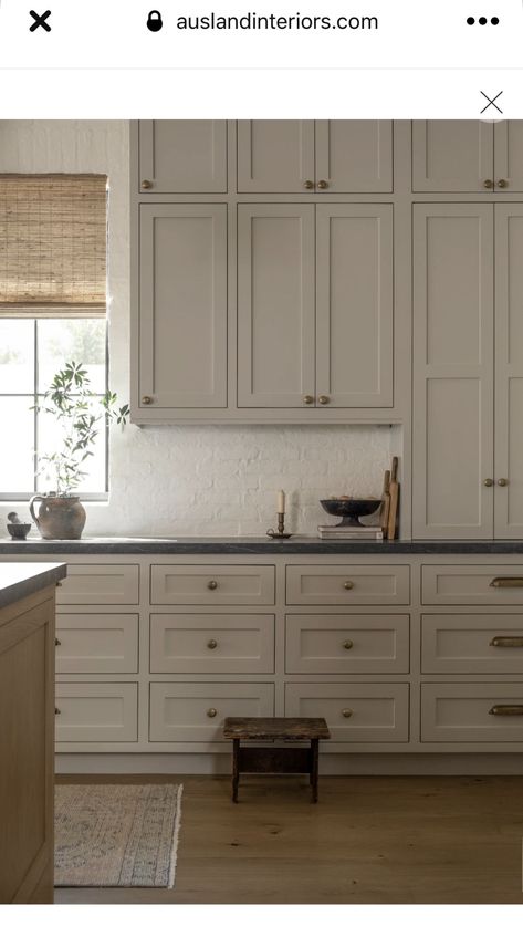 Neutral Kitchen Black Counter, Dark Taupe Cabinets Kitchen, Neutral Tone Kitchen Cabinets, Black Counters Grey Cabinets, Greige Cabinets Dark Countertops, Wintucket Cabinets Kitchen, Kitchen With Beige Walls, Taupe Kitchen Cabinets Dark Countertops, Cream Cabinets Grey Countertops