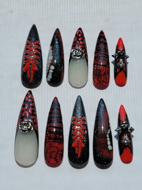 Size small Lace accents, molded ribbons, and y2k goth inspired Frenchies XL stiletto, thumb to pinky: 4(15mm), 8(11), 7(12), 8(11), 11(8) 10pc nail set with nail application kit (cuticle pusher, glue, adhesive tabs, buffing block, and alcohol wipes) Application: 1. Ensure your hands are washed and clean before application  2. Compare press on to fingernail and make sure they fit. If not, file away any excess to fit to your nail bed 3. Gently push back cuticles with cuticle pusher, and remove shine from fingernails with the buffer. You do not need to buff the underside of the press on as each nail has already been chemically etched for better adhesion 4. Wipe your nails with the alcohol pads to remove oils and increase longevity of set 5. Pick either your nail glue or tabs. It's recommended Stitches Nails, Matching Couple Nails Goth, Nail Inspo Goth, Creepy Cute Nails, Goth Acrylic Nail Designs, Centipede Nails, Bone Nails, Alt Press On Nails, Punk Press On Nails