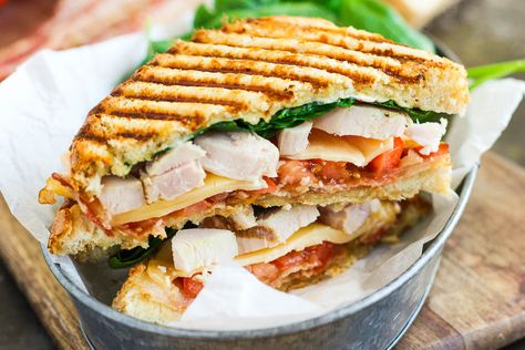 This Chicken Bacon Ranch Panini is fast, fresh, and ready in no time. Loaded with tender chunks of chicken, crisp bacon, fresh spinach, Havarti cheese, and a garlic ranch dressing, this sandwich is packed with flavor and makes the perfect, easy meal! Chicken Bacon Ranch Panini, Garlic Ranch Dressing, Chicken Pesto Panini, Sandwich Panini, Turkey Panini, Garlic Ranch, Chicken Panini, Panini Recipes, Panini Sandwiches