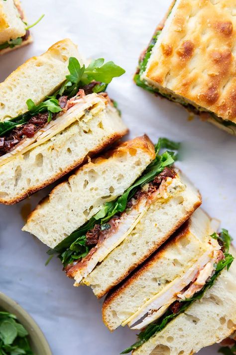 Layers of roast turkey, cheese, and flavorful sundried tomatoes star in this turkey focaccia sandwich that's so easy to whip up and perfect for leftover turkey! Roast Turkey Sandwich Recipes, Turkey Melt Sandwich, Turkey And Cheese Sandwich, Focaccia Sandwich, Turkey Melt, Turkey Sandwich, Turkey Cheese, Sundried Tomatoes, Creamy Pesto