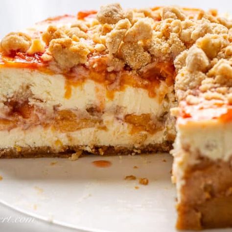 Peach Cobbler Cheesecake - Saving Room for Dessert Peach Crumble Cheesecake, Peach Cobbler Cheesecake Recipe, Peach Cobbler Cheesecake, Chocolate Spritz Cookies, Peach Crumble Pie, Peach Cupcakes, Peach Cheesecake, Peach Crumble, Sweet Breakfast Treats