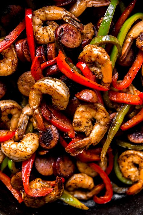 Cajun Stir Fry | KJ & Company - a vibrant twist on a favorite weeknight meal! Classic stir fry takes a vacation when shrimp are tossed in cajun seasoning and seared with cajun-style smoked sausage. Toss in some sliced bell peppers and sauté to perfection. You only need a handful of ingredients for a delicious, flavor-packed dinner! Get the recipe on https://kjandcompany.co #recipe #dinner #easydinner #weeknightmeal #stirfry #shrimp #cajun #easydinnerideas #glutenfree #recipeideas Sausage And Shrimp Recipes, Sausage Stir Fry, Stir Fry Shrimp Recipes, Cajun Shrimp Recipes, Smoked Sausage Recipes, Steak And Shrimp, Sausage Dishes, Pork Stir Fry, Shrimp Recipes For Dinner