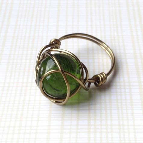 Forest Green Bead Wrapped in Antique Brass Wire Ring, size 7 by TheWireTorch on Etsy https://www.etsy.com/listing/243156913/forest-green-bead-wrapped-in-antique Wire Jewelry Patterns, Jewelry Knowledge, Asymmetrical Earrings, Green Rings, Wire Ring, Diy Wire Jewelry, Wire Rings, Beaded Wraps, Handmade Jewelry Diy