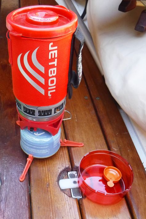 Jetboil’s Flash Cooking System is pot, stove, and fuel all in one tidy and easily stowed package. It is very quick to boil water and simmers gently enough to make cooked meals without scorching. The pot has a neoprene insulating sleeve to retain heat and a webbing handle so you don’t need a pot gripper. #boatgear #boattips #boating #camping #campinggear #gear #cooking Boat Stove, Jet Boil, Tiny Boat Nation, Boat Bowl, Center Console Fishing Boats, Aluminum Fishing Boats Modification, The Flame, Small Boats, Camping Gear