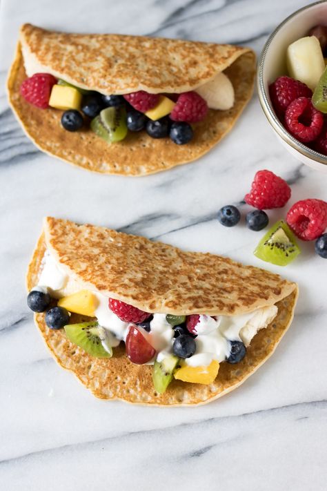 Fruit tacos are a fun, but healthy, dessert for kids and grown ups. The fruit filled crepes are quick, easy and endlessly customisable. Tacos For Kids, Fruit Tacos, Fruit Taco, Filled Crepes, Dessert For Kids, Fruit Recipes For Kids, Veggie Desserts, Healthy Desserts For Kids, Fruit Recipes Healthy