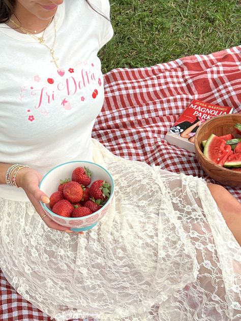 Berry cute 🍓 Message us to start your order today!! #bidday #sorority #outfitinspo #recruitment #picnic #tridelt #tridelta sorority merch, sorority designs, greek life, picnic, college, bid day, outfit inspo, tri delta, red, recruitment, baby tee Picked The Best Bid Day, Sorority Tea Party, Sisterhood Events, Sorority Themes, Tri Delt, College Event, Alpha Gam, Magnolia Park, Sorority Merch