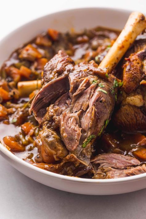 These Instant Pot lamb shanks are braised in a rich deeply flavored red wine until they're fall off the bone tender! They take a fraction of the cooking time compared to oven braised lamb shanks, and are much easier to make in the Instant Pot. #lambshanks #instantpotlambshanks Instapot Lamb Shanks, R3 Recipes, Lamb Shanks Recipe, Shanks Recipe, Lamb Roast Recipe, Cook Lamb, Slow Cooked Lamb Shanks, Wine Gravy, Mashed Potatoes And Gravy