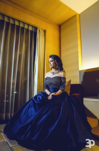 Indo Western Gown - Blue Off Shoulder Gown with Sequinned Boddice | WedMeGood  Photo by: Perfect Pixels Production #wedmegood #indianbride #indianwedding #bridalgown #gown #offshouldergown #blue #silver #indowestern Light Lehngas, Blue Indo Western Dress, Engagement Gowns Elegant, Princess Lehenga, Engagement Dress For Bride, Engagement Gown, Engagement Gowns, Western Gown, Indian Wedding Gowns