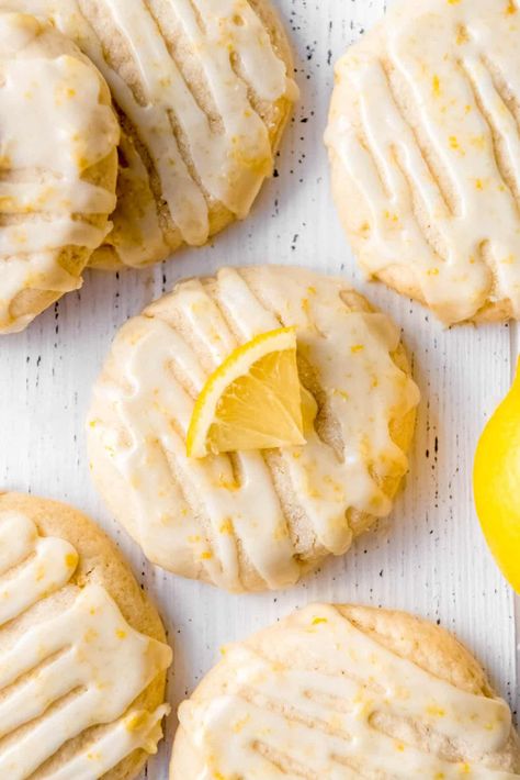 These Glazed Lemon Cookies are one of my all-time favorite cookies! The texture is melt-in-your-mouth tender and just a little crisp on the outside with a buttery lemon flavor. Then they are drizzled with a bright, sweet lemon glaze made with fresh lemon juice and zest that makes them irresistible! Try this glazed lemon cookies recipe this summer for an easy summer dessert idea! Lemon Christmas Cookies, Cookies House, Cookie Glaze, Cookie Stand, Lemon Cookies Recipes, Easy Christmas Cookie Recipes, Lemon Dessert Recipes, Cookie House, Cream Cheese Cookies