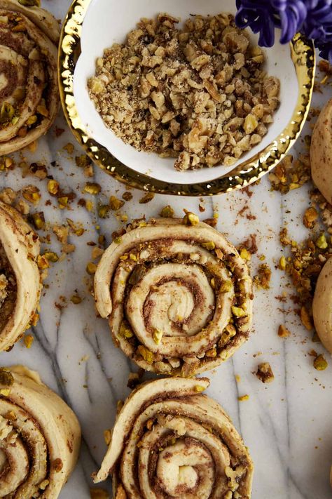 Pistachio Walnut Cinnamon Rolls are made with a secret ingredient and tons of flavor for the easiest, most delicious cinnamon rolls with nuts you’ll ever taste! Prepare them for a breakfast or brunch that will leave your guests practically licking their plates. Baklava Cinnamon Rolls, Flavored Cinnamon Rolls, Walnut Cinnamon Rolls, Christmas Cinnamon Rolls, Walnut Rolls, Roll Desserts, Walnut Roll, Holiday Breads, Cinnamon Roll Desserts