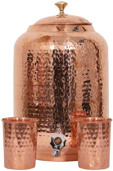 PRICES MAY VARY. Pack of One 5 Liter Copper Tank 2 Glass Material : 100% Copper Made in India, Manufactured by Copper Portal Dimension Pot : 20X20X28 Cm Weight : 1350 Gram Most of us must have heard about the health benefits of drinking water stored in a copper pot, isn't it? Well to make it easy access to our customers, we have introduced Copper Water Dispenser with 2 Glasses . It helps in improving the digestion system, reduces stomach acidity and gas, balances hypertension and also helps in r Ayurveda Healing, Healing Water, Copper Bottle, How To Clean Copper, Storing Water, Copper Jug, Copper Utensils, Copper Vessel, Water Storage Tanks