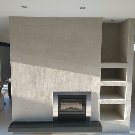 The client wanted a rustic, natural and soft look for the main feature wall in their home. The original wall was a standard paint over GIB board. The natural lime plaster finish is a slightly undulating, rough texture that creates a unique focal point and helps to provide a healthy and comfortable living environment. Rough Render Wall, Rough Plaster Fireplace, Rough Plaster Walls, Quonset House, Lime Render, Veneer Plaster, Healthy Earth, House Renovation Design, Lime Plaster