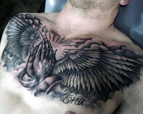 Mens Chest Tattoo Of Praying Hands With Angel Wings Chest Tattoo Wings, Tattoo Lower Back, Christus Tattoo, Tato Flash, Wing Tattoo Men, Praying Hands Tattoo, Wing Tattoo Designs, Cool Chest Tattoos, Pieces Tattoo