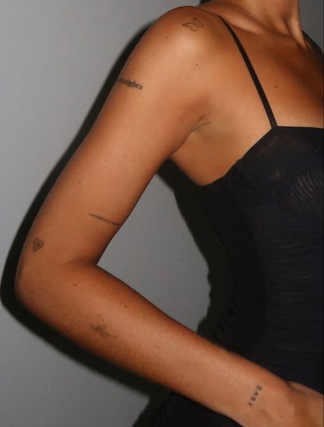 Arm Full Of Tattoos, Discreet Arm Tattoos For Women, Horizontal Shoulder Tattoo, Places To Put Word Tattoos, Dainty Upper Arm Tattoo, Minimal Sticker Sleeve, Minimal Tattoo Quotes, Patch Work On Back Tattoos, Tiny Tattoos Arm Women