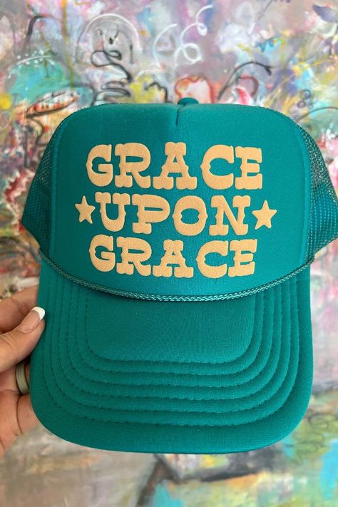 Introducing our "Grace Upon Grace" Trucker Hat. A symbol of elegance and positivity, designed for the woman who appreciates style with a touch of grace. Featuring the classic trucker hat design, this accessory effortlessly combines comfort and elegance. The breathable mesh back ensures a cool and comfortable fit, making it the perfect choice for sunny days, casual outings, or whenever you want to add a touch of grace to your look. Christian Trucker Hats, Womens Trucker Hat, Bar Shirt, Christian Hats, Grace Upon Grace, Custom Trucker Hats, Circle Outline, Grace To You, Hat Ideas