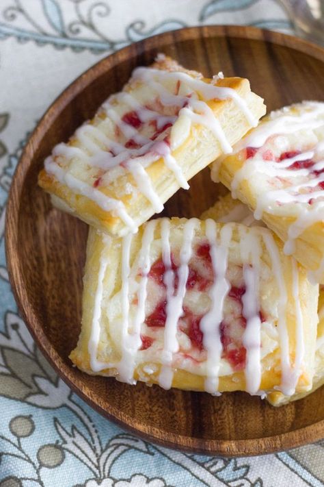 Raspberry Cream Cheese Danish - Sweet, flakey, buttery puff pastries filled with raspberry swirled cream cheese! #raspberry #creamcheese #danish #breakfast #dessert Raspberry Cream Cheese Danish, Raspberry Cream Cheese, Cheese Danish Recipe, Pastries Recipes Dessert, Puff Pastry Filling, Puff Pastry Desserts, Cream Cheese Danish, Raspberry Cream, Cheese Danish