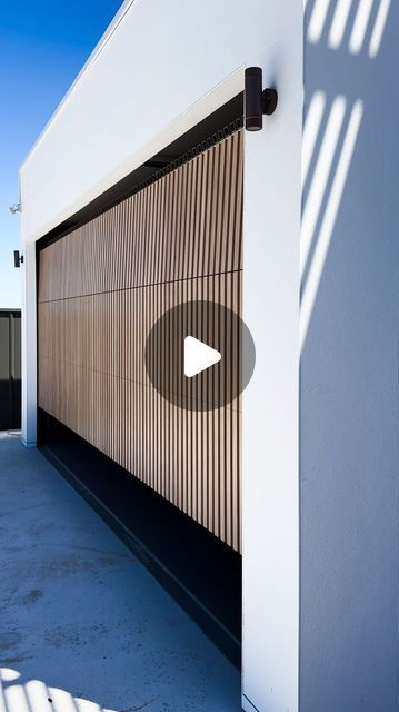 TOWER GARAGE DOORS AUSTRALIA on Instagram: "Seamlessly blending aesthetics and durability, this aluminum sectional door is meticulously clad with 40x40 aluminum battens, offering a contemporary and sturdy entrance solution." Aluminum Garage Doors Modern, Garage Entrance To House, Carport In Front Of Garage, Car Entrance, Contemporary Garage Doors, Modern Carport, Garage Windows, Garage Entrance, Sectional Garage Doors