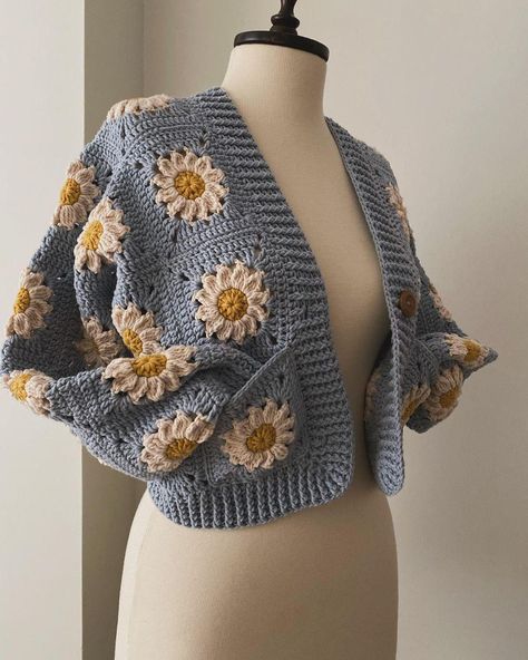 Welcome to VenusArt 🌻This magnificent sunflower cardigan can be yours for this price! Hurry up so you don't miss it!! I produce my products specially for you from cotton yarns. Owning this high quality product is not far at all :) 🌻If you have a different color request, don't forget to write it in the notes section! 🌻If you want to see more products, click on this link and follow my instagram page. https://crochetvenusart.etsy.com https://www.instagram.com/crochetvenusart/ 🌻VenusArt workshop Crochet Daisy Granny Square Cardigan, Crochet Crop Jacket, Daisy Cardigan Crochet, Sunflower Crochet Cardigan, Cottagecore Crochet Ideas, Crochet Daisy Cardigan, Red Crochet Cardigan, Crochet Flower Cardigan, Crochet Crop Cardigan