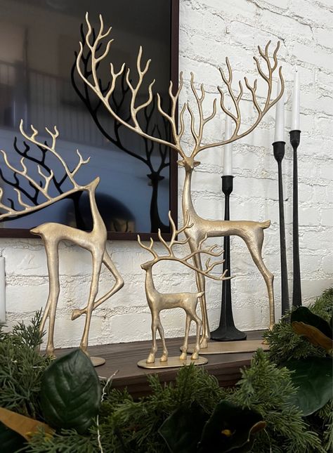 Gold Deer Christmas Decor, Christmas Decor With Candlesticks, Reindeer Mantle Decor, Reindeer On Mantle, Decorating With Reindeer For Christmas, Gold Reindeer Christmas Decor, Holiday Fireplace Mantle Decor, Black Reindeer Christmas Decor, Gold Reindeer Decor