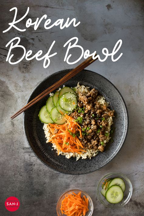 Korean Beef Bowls are an easy recipe perfect for a quick lunch or dinner! The comination of beef marinated with San-J Korean BBQ Sauce served over brown rice and topped with pickled vegetables is mouth-watering! #AsianFood #AsianCooking #EasyRecipes Korean Style Beef Rice Bowl With Cucumbers, Korean Bbq Rice Bowl, Beef Bowl Recipe, Korean Beef Bowl, Korean Bbq Sauce, Marinated Cucumbers, Asian Beef, Beef Bowls, Gluten Free Soy Sauce