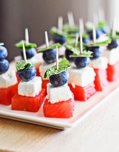 It doesn't get any easier than fruit kabobs. Assemble the blueberry, watermelon and feta on a toothpick, garnish with mint leaves and, voila! Get the recipe here. Watermelon Feta Skewers, Blueberry Skewers, Easy July 4th Recipes, Watermelon Appetizer, Summer Apps, Fruit Skewers, Watermelon And Feta, Fruit Kabobs, Skewer Recipes