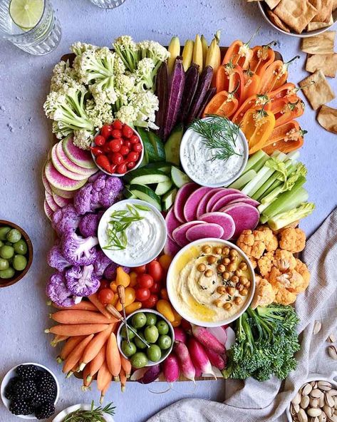 It’s no surprise that people eat with their eyes, so I like to put a little extra care into the presentation of veggie boards to make sure they look just as appealing as the other dishes I serve. The post Crudite Platter: An Elegant Veggie Tray appeared first on Ain't Too Proud To Meg. Veggie Trays Ideas Vegetable Platters, Hummus Platter, Veggie Plate, Veggie Platter, Crudite Platter, Fruit And Veggie, Watermelon Radish, Vegetable Platter, Charcuterie Inspiration