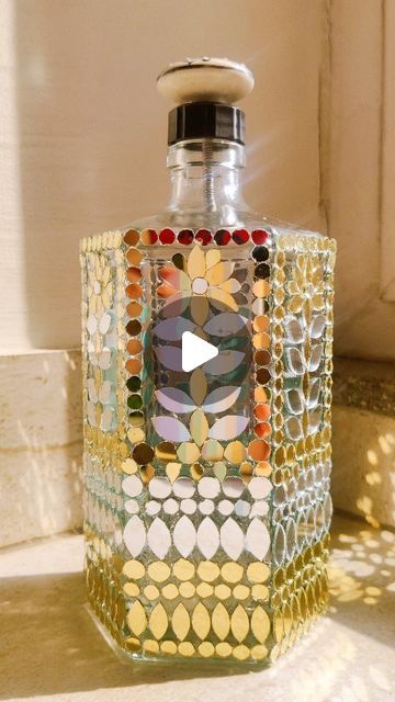 The Art Box by Swati Jain on Instagram: "Mirror Mosaic Art on Bottle - DIY #Commissionedwork #wallmirrors #mosaicartist #mirrormosaic #mosaicart #lippanartwork #instragramart #contentcreators #womanentrepreneur #artvideos #mirrorart #artreelsofinstagram #viralvideos #bottleart #mirrormosaic #mosaicartist #viralart #videoreels" Mirror Mosaic Art, Mosiac Mirror, Bottle Work, Art Facts, Bottles Decoration Diy, Bottle Art Projects, Bottle Paint, Wonder Wheel, Shankar Mahadevan