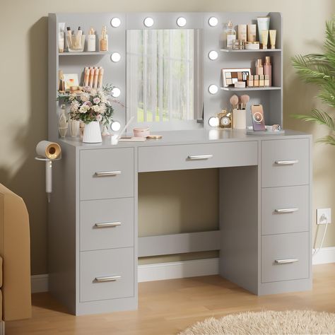 PRICES MAY VARY. 💎SPACIOUS STORAGE：With seven drawers and four open shelves, this vanity desk offers ample storage space for all your beauty essentials. Keep your brushes, palettes, and cosmetics neatly organized and within reach. Plus, the large desktop provides a spacious workspace for your makeup applications. 💡BRILLIANT ILLUMINATION: Featuring a mirror with 10 bulbs, this vanity desk ensures you have the perfect lighting for your makeup applications. With three different light modes and ad