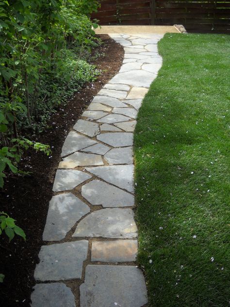 Linley Residence, April 2010 Portland, Oregon  Materials:  Iron Mountain flagstone walkway Decomposed Granite framed pad Raised Cedar planting beds (3 @ 4x8') Decomposed Granite paths River rock treerings Sod lawn  Edible plantings:  blueberry, raspberries, rhubarb, herb garden, apple and pear trees Side Walks Ideas Walkways Pathways, Side Of House Walkway Ideas, Flagstone Sidewalk, Flagstone Ideas, Yard Walkway, Flagstone Pathway, Crushed Granite, Flagstone Walkway, Flagstone Path