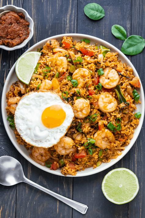 Thai Tom Yum Fried Rice is a crowd pleaser! Our homemade version is incredibly easy because it uses store-bought paste packed with flavor. #tomyumfriedrice #thaifriedrice #thairice Tom Yum Fried Rice, Rice Wok, Vegetarian Rice Recipes, Thai Fried Rice, Chinese Bbq Pork, Tom Yum, Thailand Food, Fried Rice Recipe, Chinese Dishes