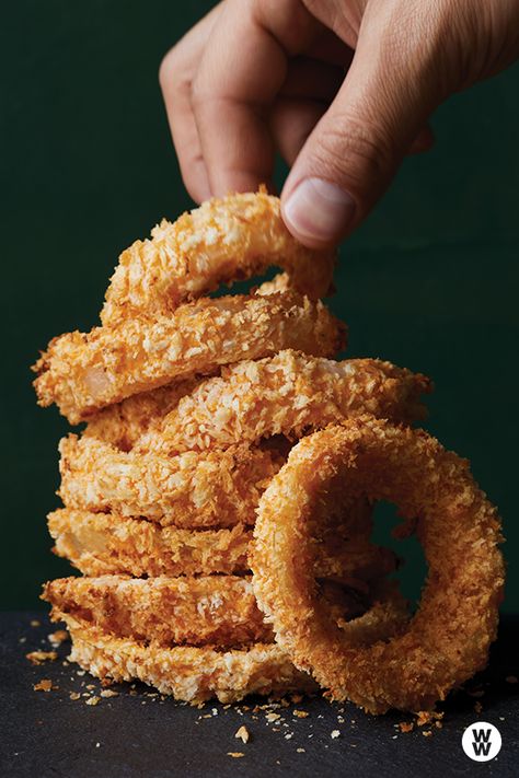 Crispy buttermilk onion rings: Wonderfully crisp and crunchy onion rings are an all-time fave with burgers. These stay crispy for up to an hour, so you have plenty of time to fire up the grill. Onion Rings Photography, Crispy Air Fryer Onion Rings, Onion Ring Photography, How To Make Onion Rings In Air Fryer, Homemade Onion Rings Air Fryer, Homemade Air Fryer Onion Rings Recipe, Buttermilk Onion Rings, Crunchy Food, Onion Rings Recipe