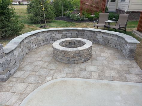 This is a great way to add on to a concrete patio.  We added some pavers, a fire pit and curved seat wall.  With some landscaping to transition the 2 types of materials, this patio really came together Paver Fire Pit, Fire Pit Gallery, Fire Pit Materials, Modern Fire Pit, Rustic Patio, Backyard Plan, Landscaping Retaining Walls, Small Patio Garden, Patio Fireplace