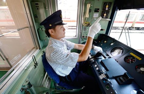 A Tokyo train driver pointing at meters on the dashboard.  I wonder how this might play out in medicine. Train Driver, Japan Train, Train Engineer, Train Conductor, Animal Crossing Clothes, Fall Flats, On The Train, New Employee, Across The Universe